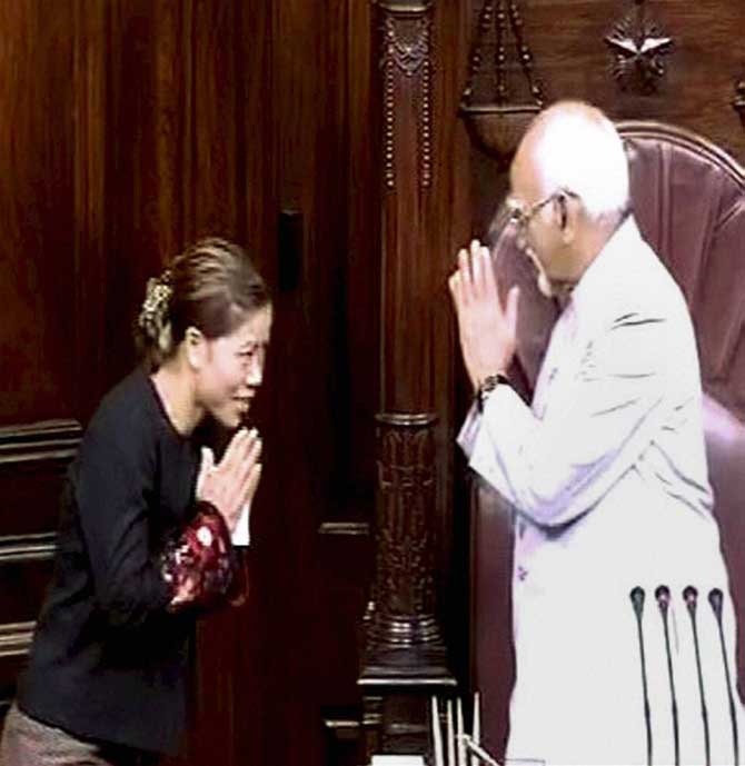 Vice President Hamid Ansari greets boxer Mary Kom after she took oath as a Member of the Rajya Sabha in New Delhi on Tuesday.