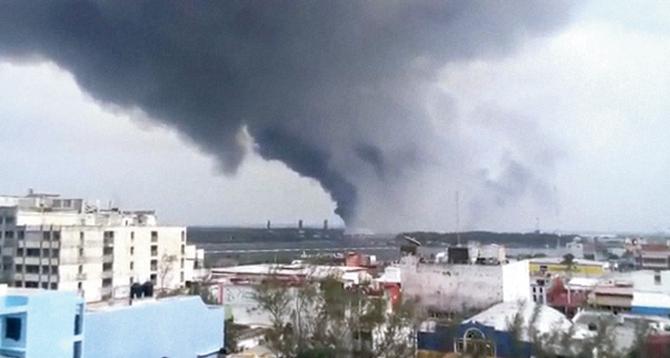 A video grab shows a large plume of smoke rising from the petrochemical plant after an explosion in Coatzacoalcos, Mexico. Pic/PTI