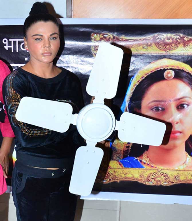 Rakhi Sawant poses with a small ceiling fan at her press conference on Tuesday in Mumbai