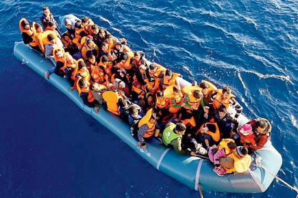 400 feared drowned as refugees' boats capsize in Mediterranean