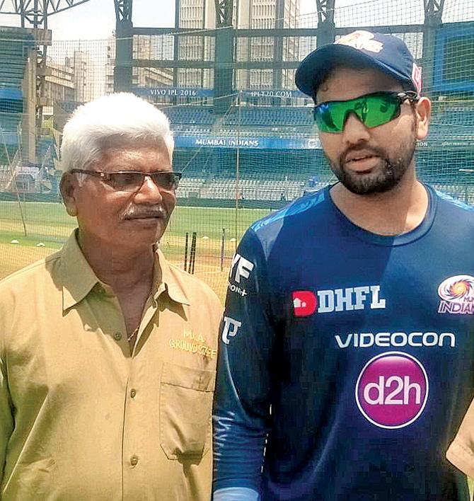 Vijay Tambe with MI skipper Rohit Sharma prior to the match between Mumbai and Kolkata at Wankhede Stadium yesterday