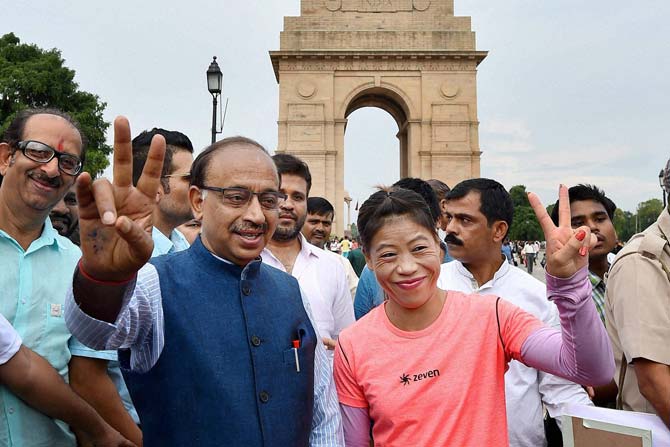 Minister of State Youth Affairs and Sports (I/C) Vijay Goel and Boxer Mary Kom after inaugurating ‘Wall Of Wishes’ & ‘Digital Campaign of Wishes’ for Indian Olympic contingent at India Gate in New Delhi on Tuesday.