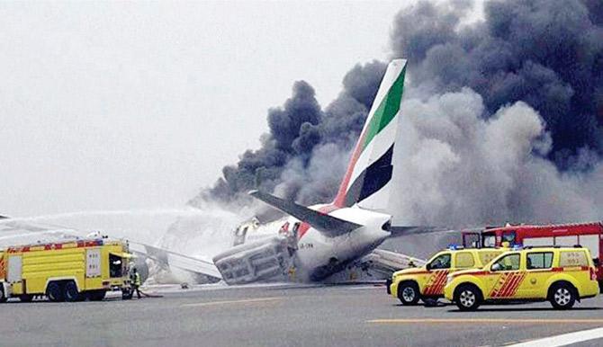 Flames being doused on the Emirates flight that crash-landed on Wednesday.