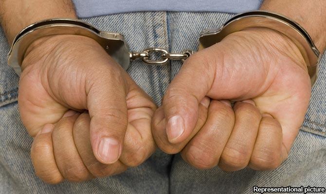 Man held for obscene act before woman in local train