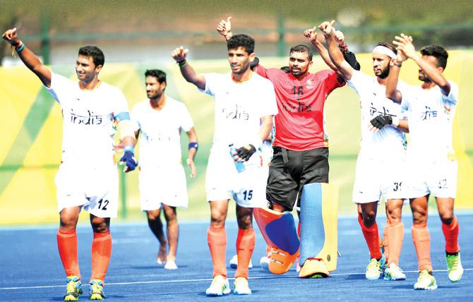Members of the Indian hockey team acknowledge their fans after the 2-1 win over Argentina at the Olympic Hockey Centre in Rio yesterday