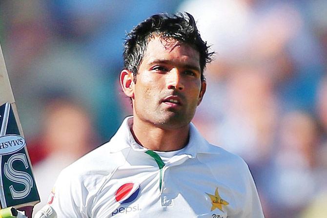 Asad Shafiq celebrates his 100 against England yesterday. PIC/Getty Images