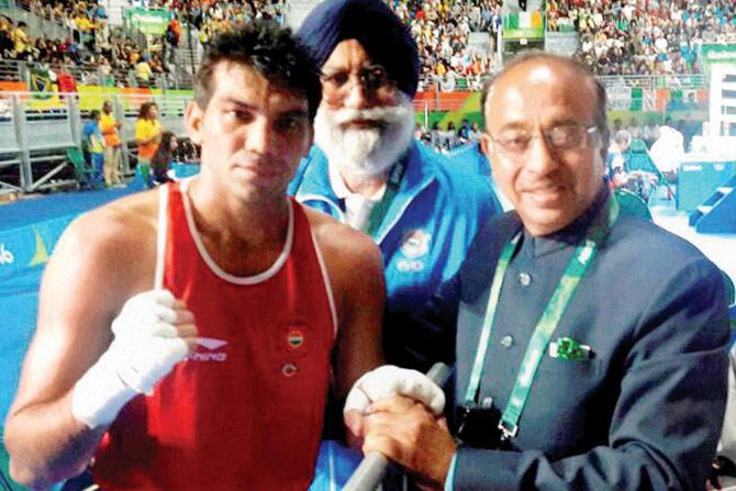 Vijay Goel (right) with boxer Manoj Kumar (left) in Rio on Wednesday PIC/PTI