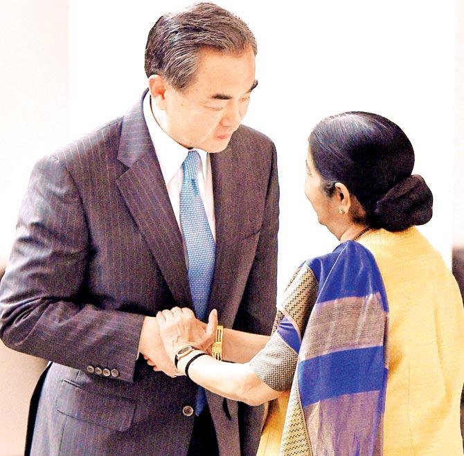 External Affairs Minister Sushma Swaraj welcomes her Chinese counterpart Wang Yi in New Delhi on Saturday. Pic/PTI