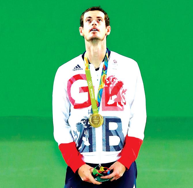 Andy Murray with his gold on the podium. Pic/Getty Images
