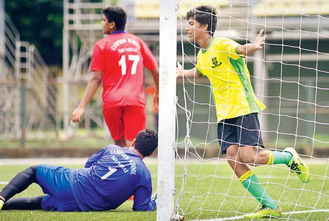 Josiah Noronha of St Stanislaus (right) celebrates after scoring against Campion in U-16 semis at Cooperage yesterday. Pic/Atul Kamble