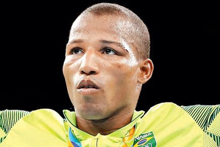 Rio 2016: Brazil's former street hawker Robson wins first boxing gold
