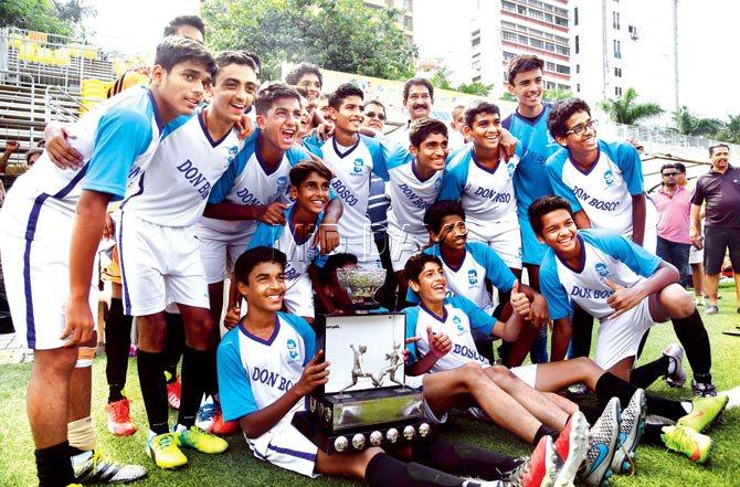 Don Bosco (Matunga) players pose with the trophy after the tie-breaker against St Stanislaus (Kandivli) at Cooperage ground. Pic/Atul Kamble
