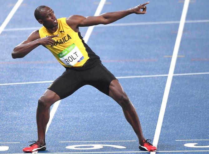 Usain Bolt strikes his winning pose