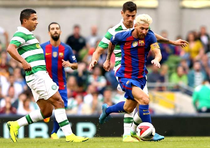 Barcelona-s Argentinian forward Lionel Messi R runs with the ball during the pre-season International Champions Cup football match between Spanish champions, Barcelona and Scottish Premiership champions, Celtic at the Aviva Stadium in Dublin, Ireland. Pic/AFP