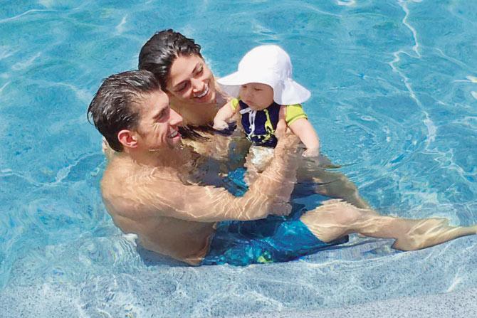 Michael Phelps with Boomer and wife Nicole Johnson