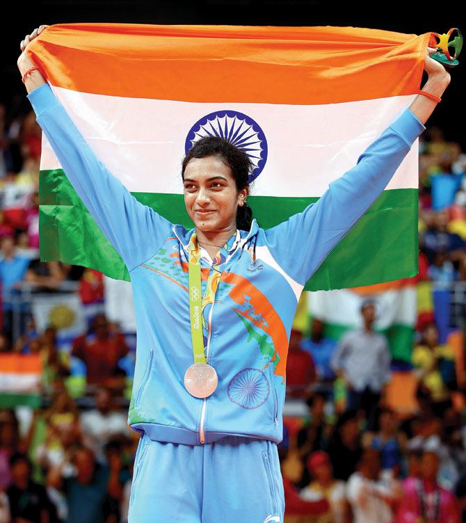 PV Sindhu poses with her silver medal after the singles final at Riocentro in Rio yesterday. pic/Getty Images