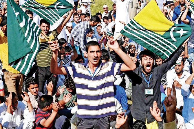 People shout slogans during a protest against civilian killings in Srinagar on Friday. Ppic/pTI