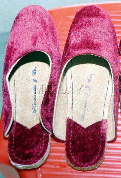 A pair of traditional maroon velvet sapaat slippers exclusively stocked at this shop PICS/SNEHA KHARABE