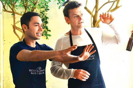 How's that! Adam Gilchrist ditches his gloves for the apron
