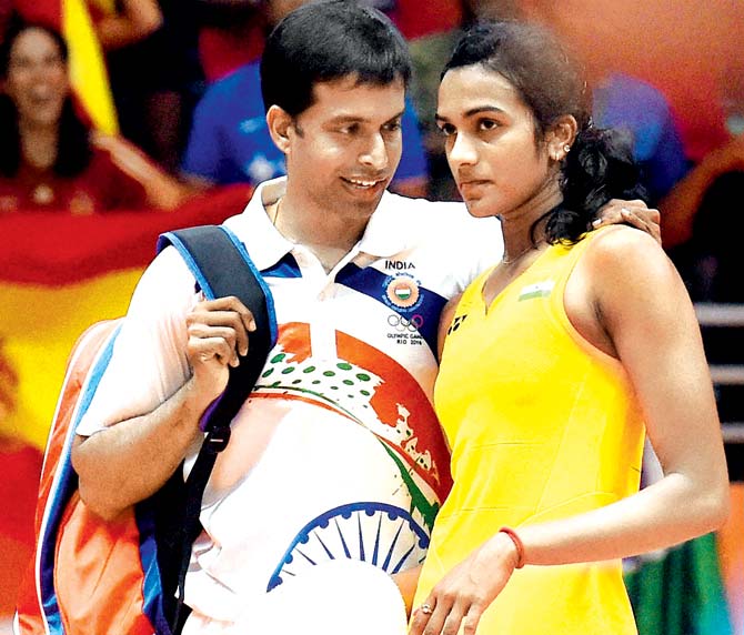 Coach P Gopichand with PV Sindhu after her final match vs Spain