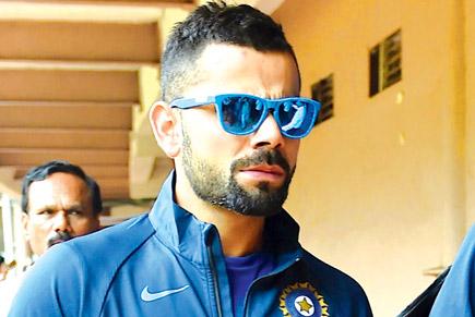 Virat Kohli raises toast to childhood coach