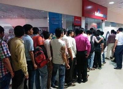 People waiting outside Reliance Digital Stores and Digital Xpress Mini Stores to get a free Jio test SIM in Ahmedabad