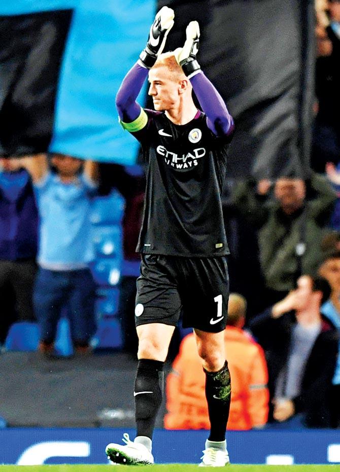Manchester City goalkeeper Joe Hart acknowledges the cheers from fans after the UEFA Champions League play-off second leg match against Steaua Bucharest at the Etihad Stadium in Manchester yesterday. Pic/Getty Images