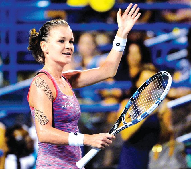 Agnieszka Radwanska celebrates her win over Petra Kvitova on Friday. Pic/AFP