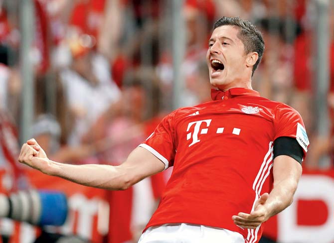Bayern Munich’s Robert Lewandowski celebrates after scoring the second goal during their Bundesliga match against Werder Bremen at Allianz Arena in Munich on Friday. Pic/Getty Images