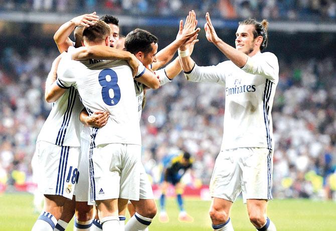 Real Madrid players celebrate a goal during the La Liga match vs Celta Vigo at Bernabeu in Madrid on Saturday. Pic/Getty Images