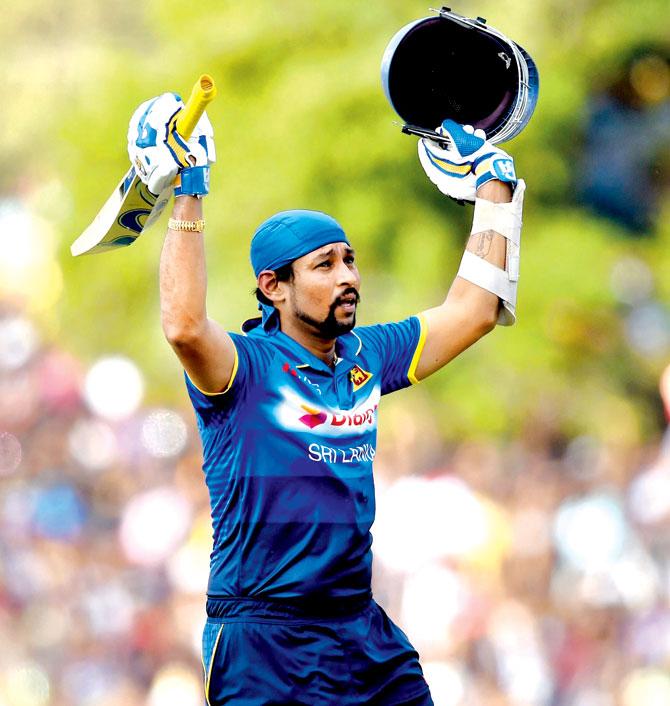 Sri Lankan Tillakaratne Dilshan acknowledges fans after he makes his way back to the pavilion at Dambulla yesterday. Pic/AFP