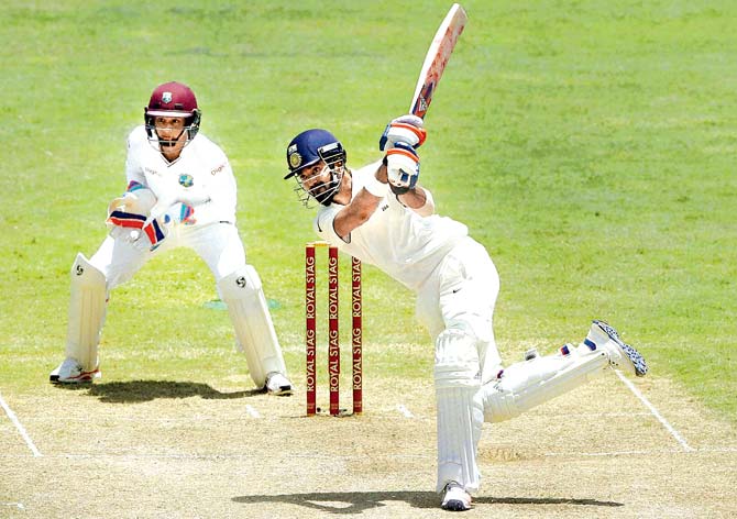 KL Rahul en route his 158 against West Indies on Sunday. Pic:AP/PTI