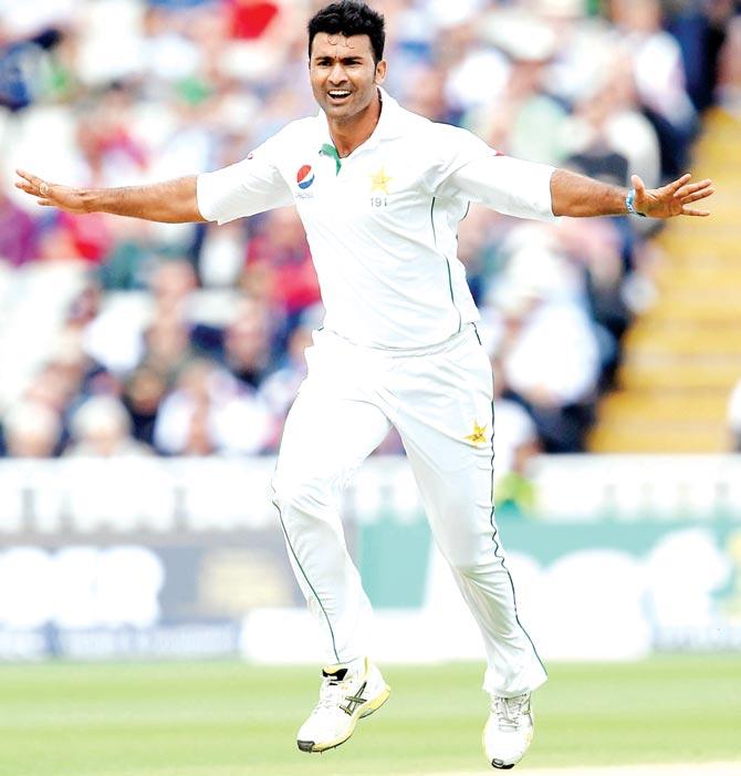 Pakistan pacer Sohail Khan celebrates the wicket of England
