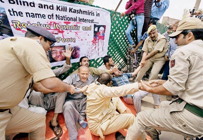 Police detain members of Awami Itihaad Party and MLA Sheikh Abdul Rashid during a protest against the civilian killings in Srinagar yesterday. Pic/PTI