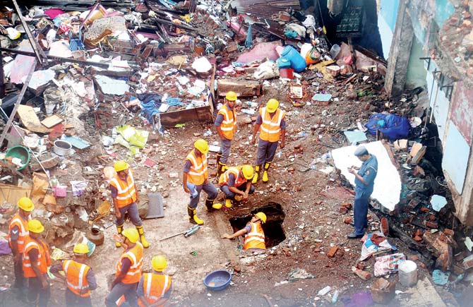 Rescue personnel look for survivors in the rubble