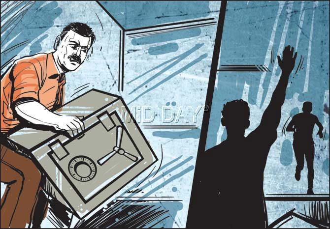 The thief tries to flee with the 25-30 kg safe, but is unable to lift it. He goes out and calls his partner and they pick up the safe and take all the cash — amounting to Rs 9 lakh