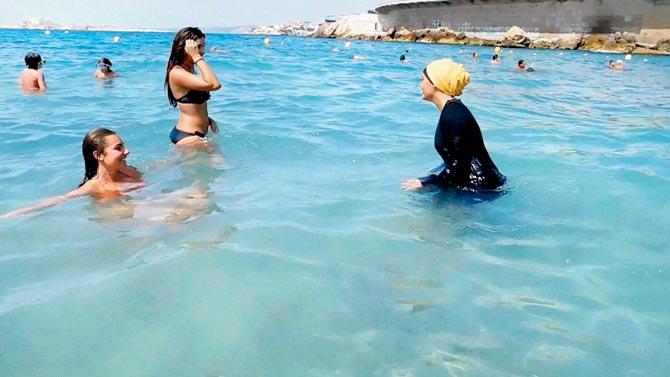 Women bathe in the sea in Marseille, France on Monday, after the burkini ban was struck down by a high court last week. Pic/PTI