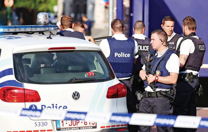 Police secure the site of the attack in Charleroi, Belgium. Pic/AFP