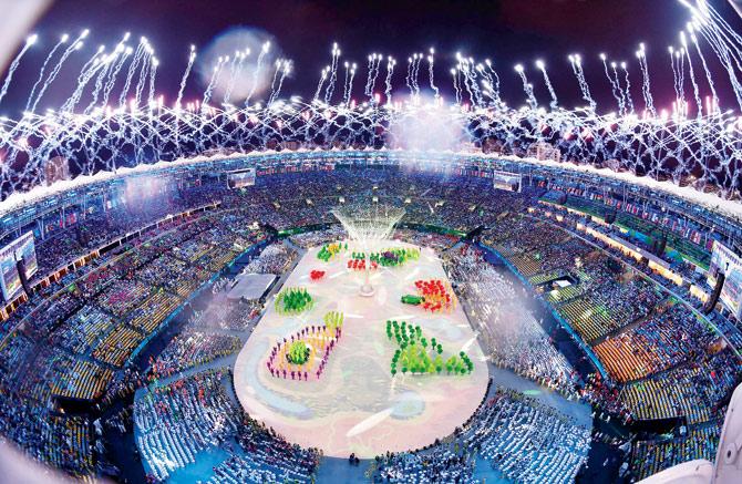 Colourful costumes and spectacular fireworks display light up the Maracana Stadium
