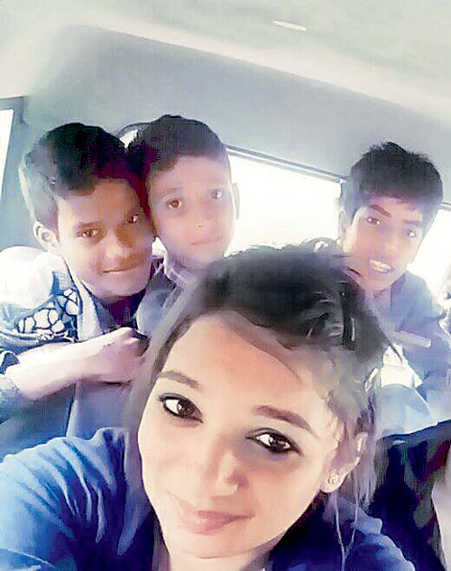 Inspector Ashwini Patil from Vasai police station with the Delhi teens