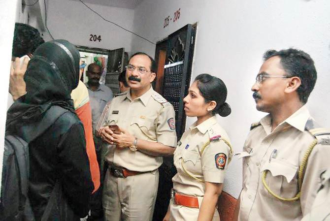 Police question neighbours at the couple’s house in Kausa, Mumbra