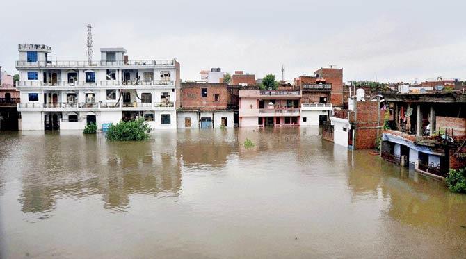 Submerged houses in flooded Govindpur area in Allahabad. Pic/PTI