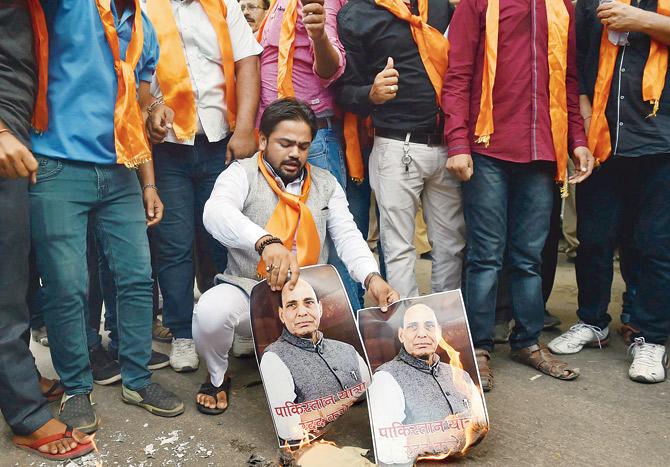 Hindu Sena activists stage a protest against Rajnath Singh’s visit to Pakistan in New Delhi on Tuesday. 