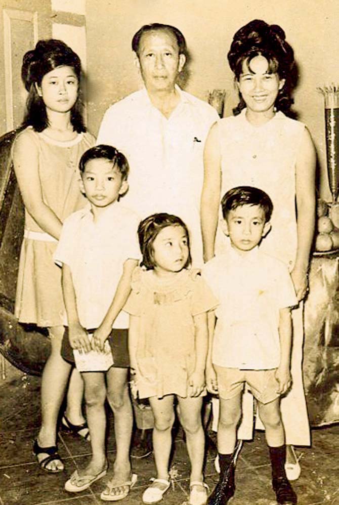 In an undated family photo, Charlie, whose real name is Pan Su Leh, is seen with wife Laichen Yun (right), a family member, and his three children, George (left), Christina and John 
