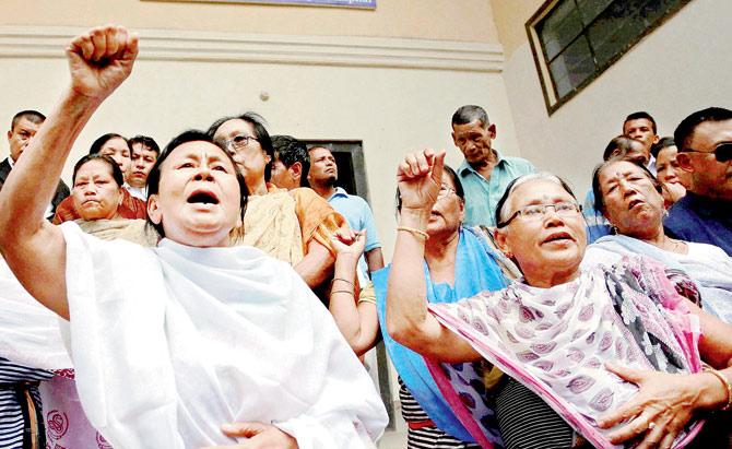 Manipuri human rights activists shout slogans against Irom Sharmila’s decision to break her fast in Imphal. pic/PTI 