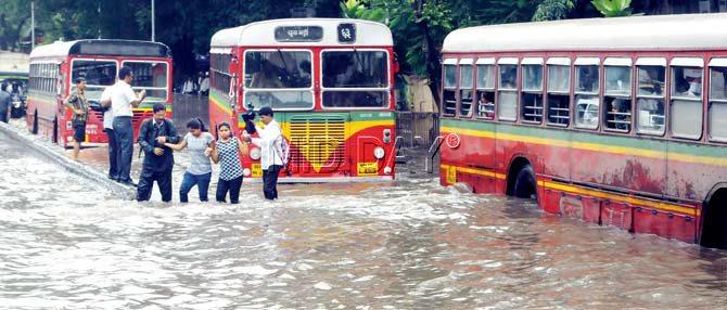 The monsoon mayhem can turn even complete strangers into friends. Commuters held hands to cross King’s Circle and waded through a flooded Parel yesterday