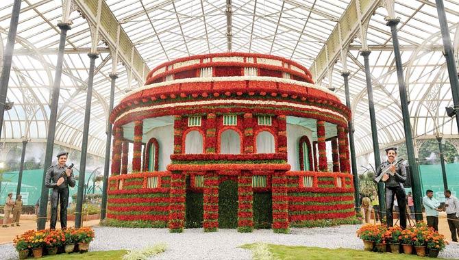 Parliament house made with flowers during a flower show to mark upcoming Independence Day in Bengaluru. Rajya Sabha approved the GST constitutional amendment bill. Pic/PTI