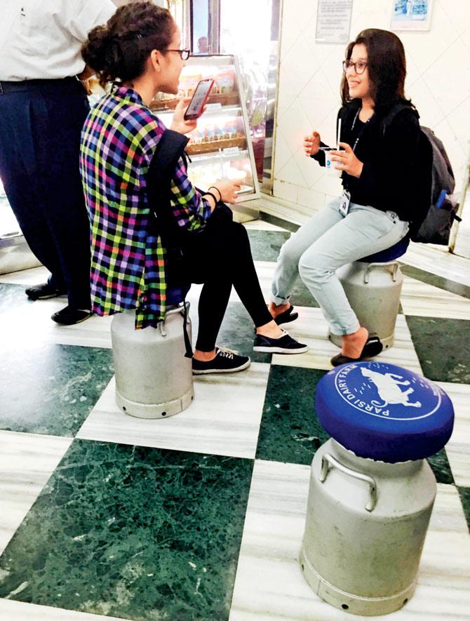 Milk canister seats at  Parsi Dairy 