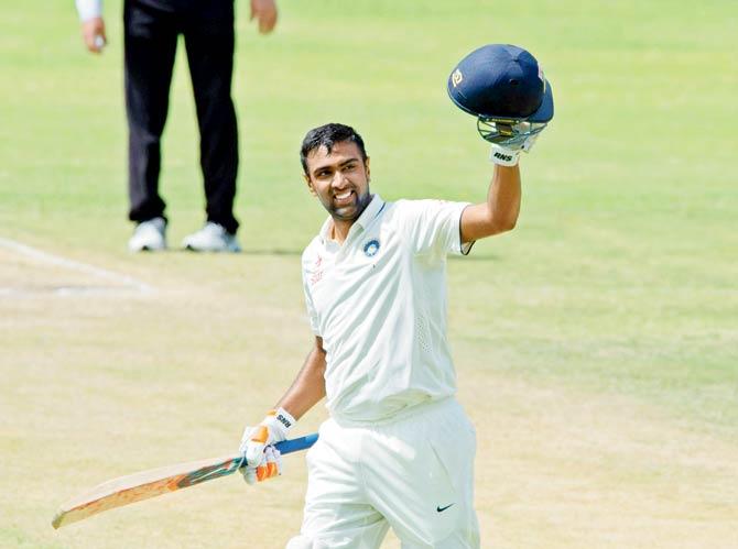 R Ashwin acknowledges the crowd after hitting a ton in the ongoing series against West Indies. Pic/AFP