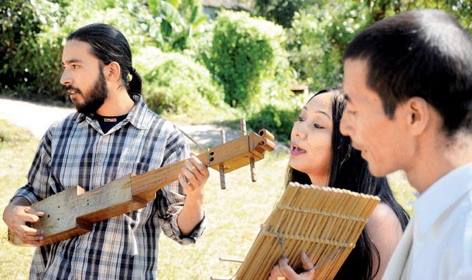 Rida Gatphoh (centre) with her band, Rida & The Musical Folks, formed in 2013, which uses traditional musical instruments like Ksing Shynrang (male drum), Ksing Kynthei (female drum), Tangmuri (windpipe) and Singphong (Reed instrument)